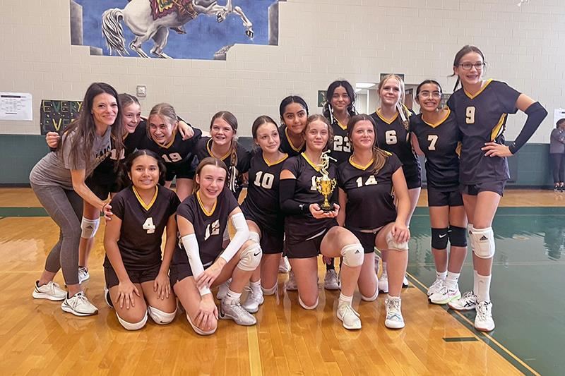 The Hamilton Middle School 7B volleyball team poses after defeating Goodson Middle School to win the district championship.
